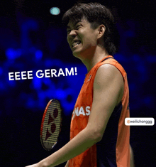 a man holding a badminton racket with the words eee geram behind him