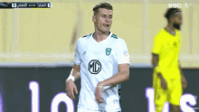 soccer player wearing a white shirt with a md logo on the front