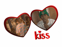 two red hearts with a picture of a man and the word kiss below it
