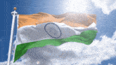 an indian flag is flying in the wind against a blue sky