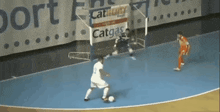 a soccer game is underway with a catgas banner in the background