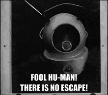 a black and white photo of a helmet with the words fool hu-man there is no escape