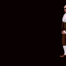 a man in a suit and tie is standing in front of a black background that says " nothing ever happens "