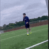 a soccer player wearing a blue shirt with the word united on it