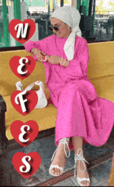 a woman in a pink dress is sitting on a yellow bench with hearts that say n f e and s