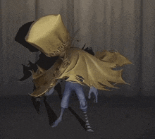 a person in a yellow cape is standing in a dark room .