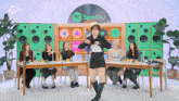 a group of women are dancing in front of a spotify logo