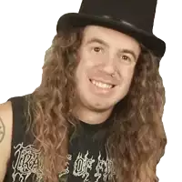 a man with long curly hair is wearing a top hat and a shirt that says ' slayer ' on it