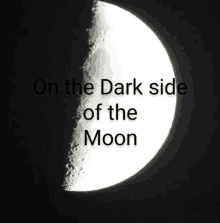 a picture of a half moon with the words on the dark side of the moon