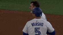 a baseball player with a td bank logo on his sleeve