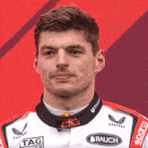 a man wearing a red bull racing uniform