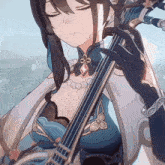 a woman in a blue dress is playing a violin