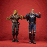 two action figures standing next to each other with one wearing a captain america outfit