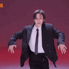 a man in a suit and tie is dancing in front of a pink background that says cutely