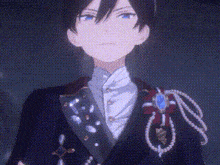 a close up of a person wearing a tuxedo with pearls and a brooch .