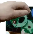 a hand is holding a piece of paper with a picture of a cartoon character on it .