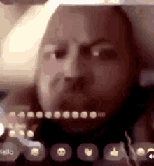 a close up of a man 's face on a video call on a phone .