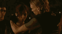 a man and a woman are dancing together in a dark room .