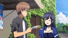 a boy and a girl are standing in front of a sign that says ' ice cream '