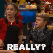 a boy and a girl are standing next to each other with the word really written on the bottom