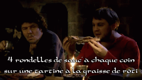two men are sitting at a table with a candle and a caption that says 4 rondelles de sauc a chaque coin