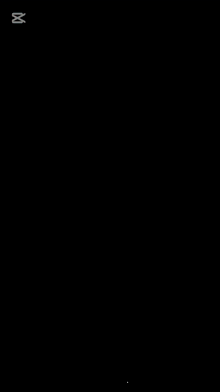 a black screen with a rainbow colored object and the words capcut