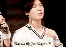 a man with a microphone around his neck says " internally freaking out "