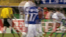 a blurry picture of a football player wearing a number 17 jersey