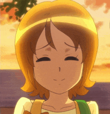 a close up of a cartoon girl 's face with a smile on her face
