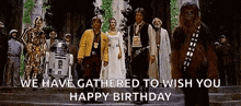 a group of star wars characters are standing next to each other on steps .