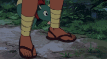 a cartoon character with a green skirt and black shorts is standing in the grass