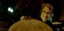 a man with blood coming out of his mouth is wearing a bow tie