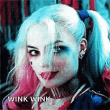 harley quinn from the movie suicide squad is sticking her tongue out .