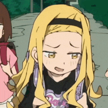 a girl with long blonde hair is wearing a shirt that says love