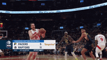 a basketball game between the tangerine raptors and pacers