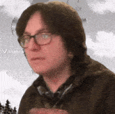 a man wearing glasses looks at the camera with the words viggle.ai visible in the corner