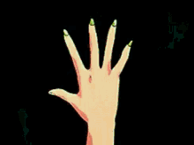 a person is holding a star in their hand with a green background