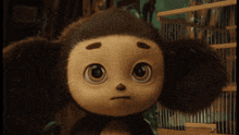 a close up of a stuffed animal with a serious look on its face