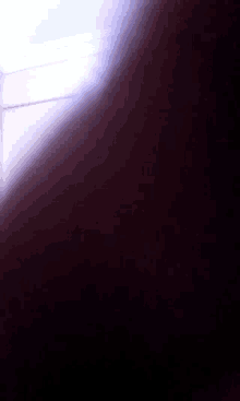 a purple background with a white light coming out of the corner
