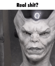 a statue of a man with the words real shit on the top