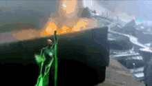 a man in a green suit is standing in front of a large explosion in a video game .