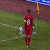 a man in a red shirt with the number one on it