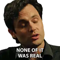 a man with his eyes closed and the words none of it was real written on his face