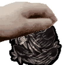 a hand is reaching into a pile of coins