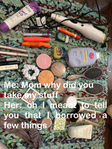 a bunch of cosmetics are laid out on a rug