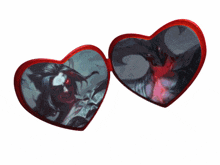 a pair of red heart shaped sunglasses with a picture of a vampire