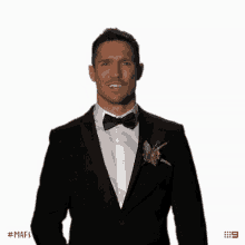 a man in a tuxedo with a flower in his pocket and the hashtag # mafs on the bottom