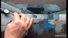 a painting is being painted with the words made in animotica visible