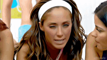 a woman wearing a white headband with editsmaite written on the bottom left