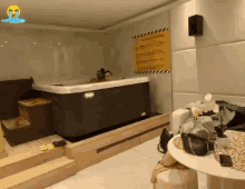 a couple in a hot tub with a sign on the wall that says warning attention